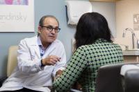 Physician consults with female patient.